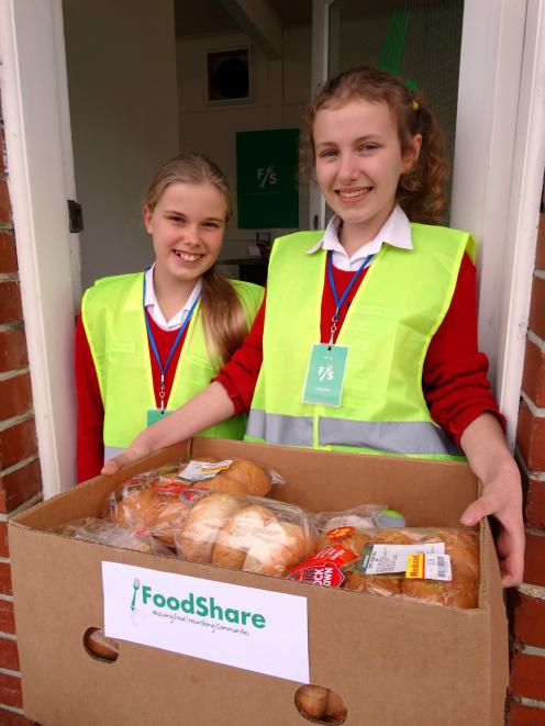 Beth Lynch (left) and Rosa Miller, of Balmacewen Intermediate School, help  at FoodShare to see...
