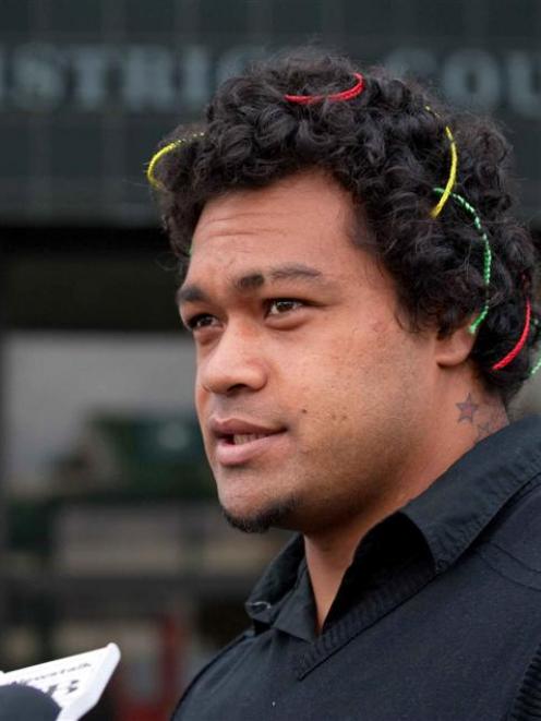 Former All Black and Chiefs rugby player Sione Lauaki speaks to news media outside Hamilton...