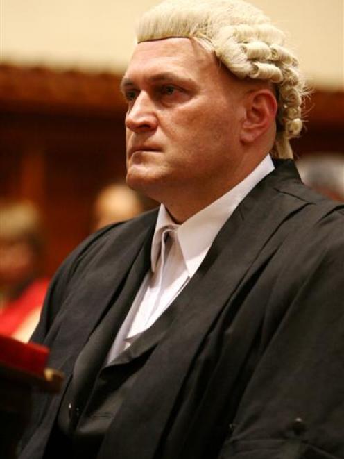 Former assistant commissioner of police Clint Rickards being admitted to the bar in a brief...