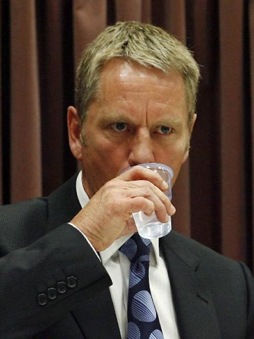 Former detective sergeant Milton Weir has a drink while giving evidence during the David Bain...