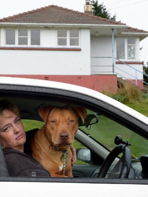 Former Housing New Zealand tenant Pam Williams and her dog PJ are living in her car after being...