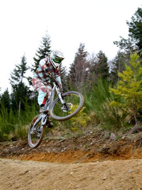 Former junior world downhill mountain bike champion Scarlett Hagen gets air at the Queenstown...