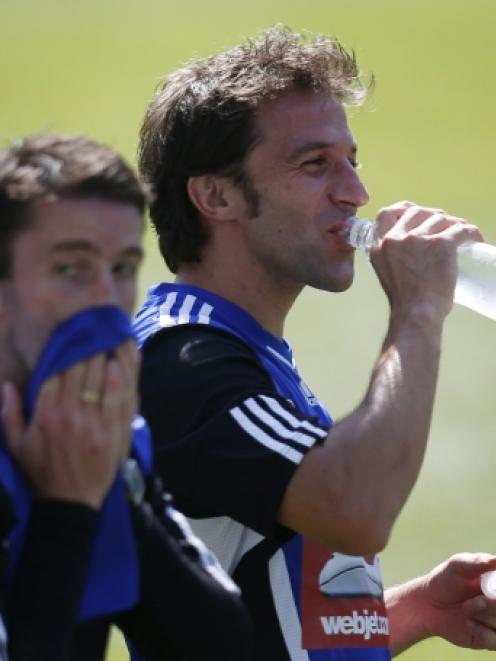 Former Juventus soccer player Alessandro Del Piero, of Italy, drinks from a bottle during his...
