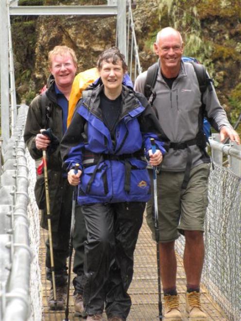Former prime minister Helen Clark walks out of the  Routeburn Track with Labour MPs Darren Hughes...