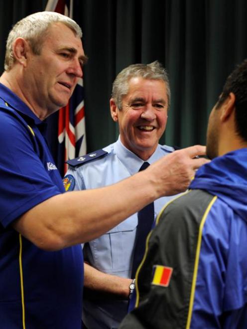 Former Romanian rugby player and retired police colonel Pompiliu Bors (left) meets Southern...