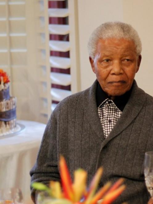 Former South African president Nelson Mandela, seen celebrating his 94th birthday at home in Qunu...