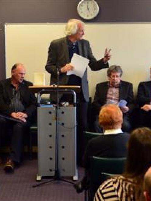 Forum convener Prof Kevin Clements (standing) speaks  at a joint health board/mayoralty forum,...