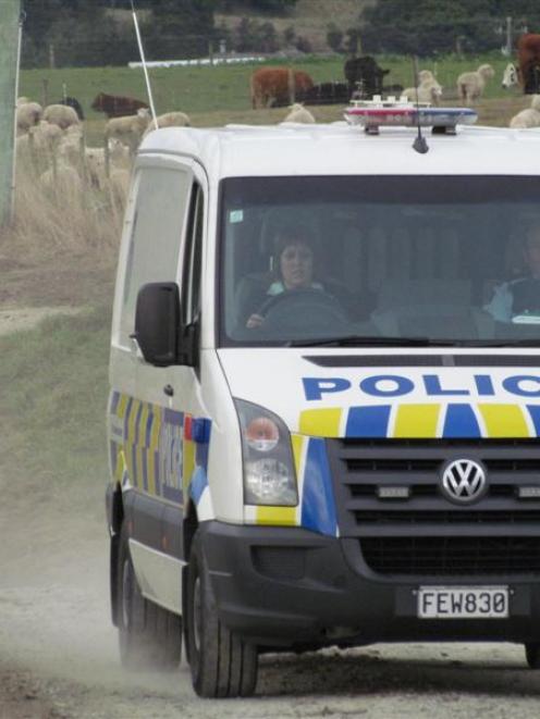 Four alleged car thieves are taken away to face charges, after a two-hour manhunt in Waianakarua...