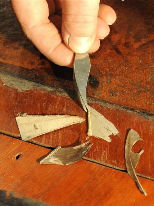 Fragments of feathers from 19th century quill pens found when the desk was dismantled. Photos by...