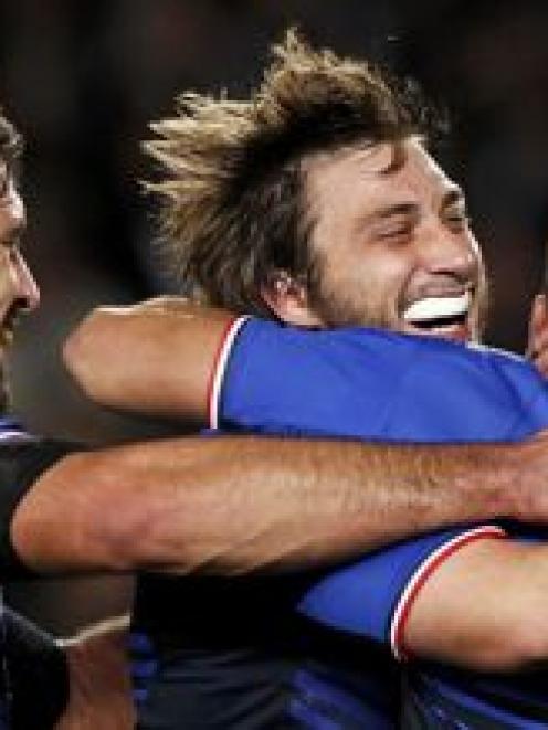 France players celebrate after winning their Rugby World Cup quarter-final match against England...