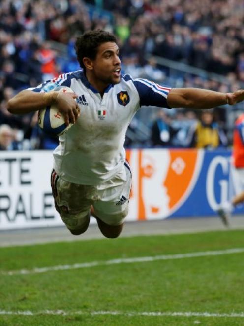 France's Wesley Fofana dives to score a try against Italy. REUTERS/Benoit Tessier