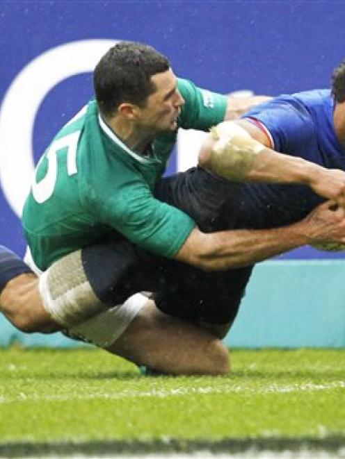 France's Wesley Fofana, right, is tackled by Ireland's Rob Kearney as he scores a try during...