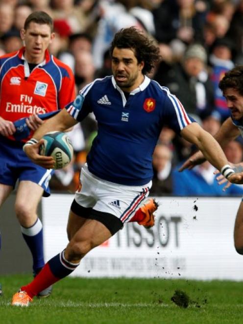 France's Yoann Huget is tackled by Scotland's Alex Dunbar during their Six Nations match at...