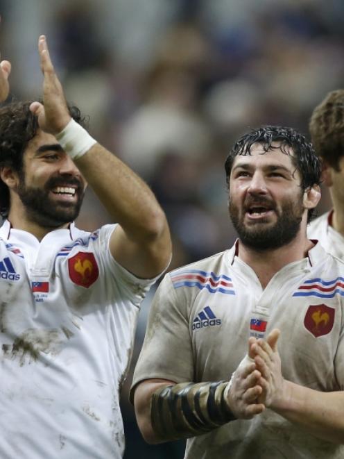 France's Yoann Huget (left) and Yannick Forestier react at the end of their team's rugby test...