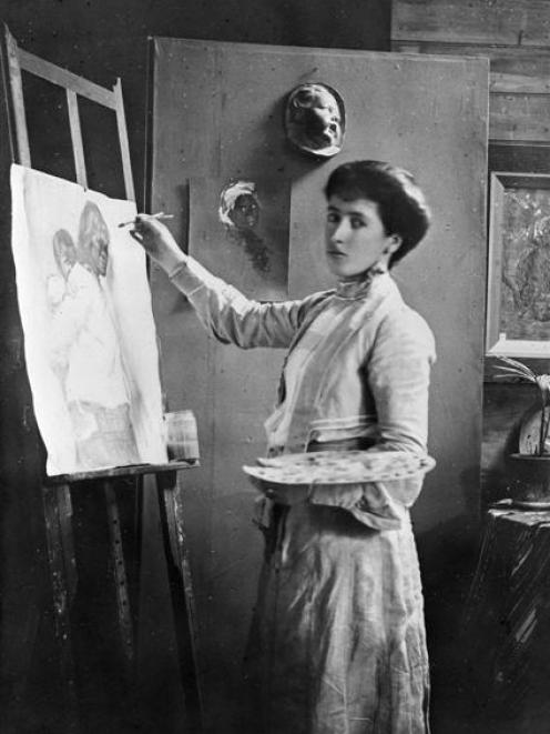 Frances Hodgkins paints at an easel in her Bowen St studio, c.1905. Photo from Alexander Turnbull...