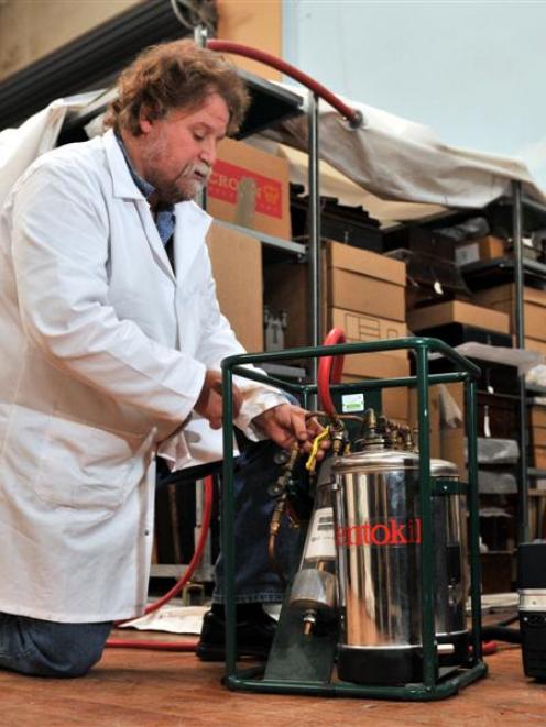 Francois Leurquin, a senior conservator at the Otago Settlers Museum, examines equipment used to...