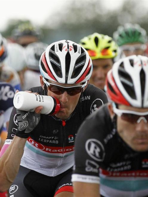 Frank Schleck drinks as he cycles during the sixth stage of the 99th Tour de France.  REUTERS...