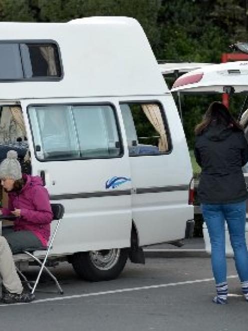 Freedom campers have breakfast at the Macandrew Bay last week. Photo by Stephen Jaquiery