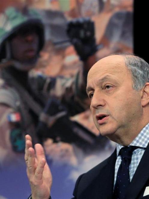 French Foreign Minister Laurent Fabius holds a news conference after NATO gave the go-ahead to...