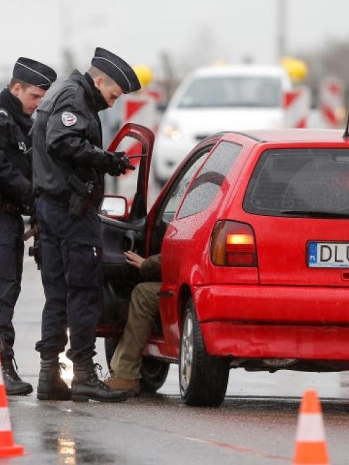 French police conduct a control at the French-German border in Strasbourg. REUTERS/Vincent Kessler