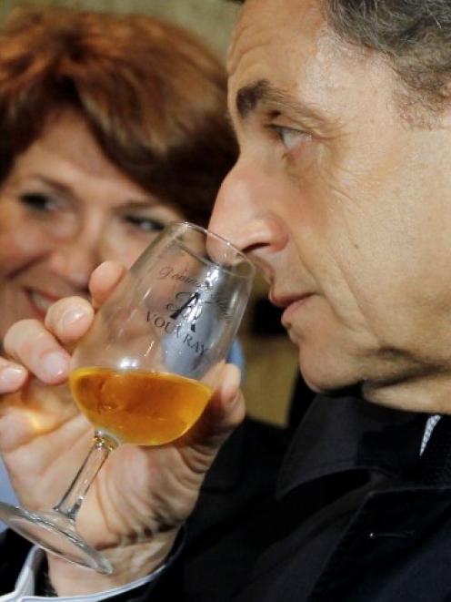 French President Nicolas Sarkozy visits a winery in Vouvray, the day after the first round of...