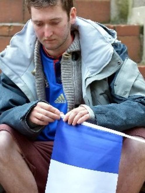 Frenchman Paul Chameret, of Normandy, struggles with his emotions during the vigil. Photo by...