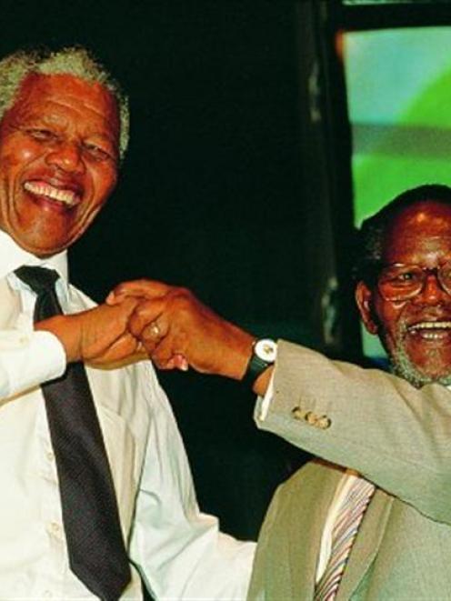 Friends and comrades Nelson Mandela and Oliver Tambo in 1990 in an image from <i>Mandela: In...