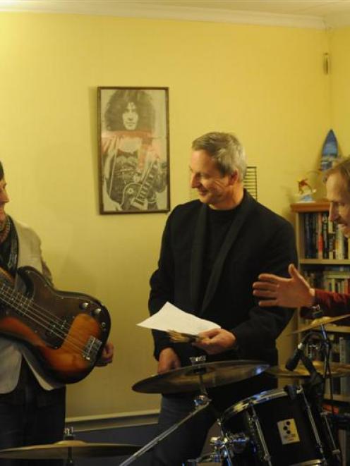 From left, bass player Gavin Shaw, drummer Ian and George D. Henderson in their Waverley practice...