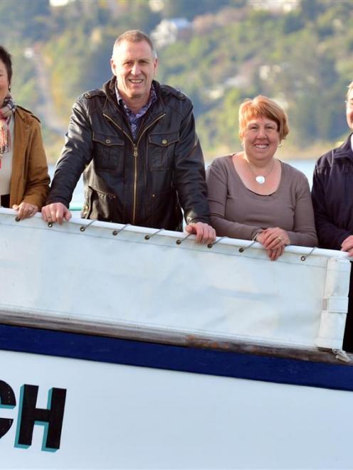 From left, new owners Anita Chan and Neil Harraway, company manager Lynne Hanley and senior...
