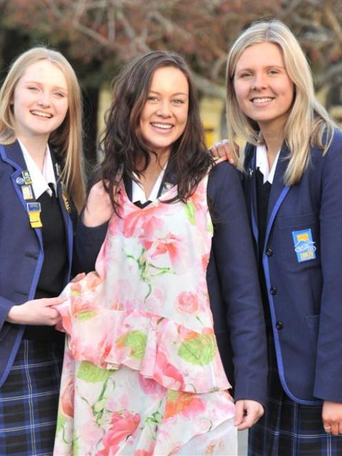 From left, Rebecca Murray (17), Kimberley Bates (17) and Kate Turner (16) before the big night....