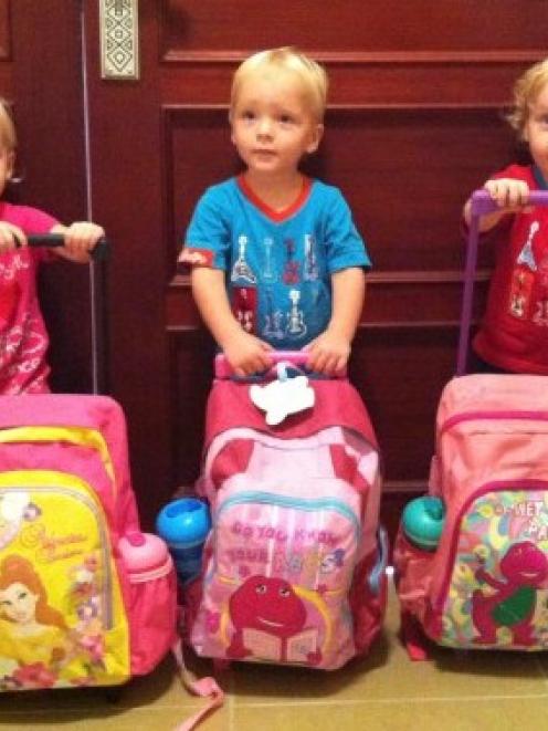 Triplets (from left) Lillie, Jackson and Wilsher Weekes died in the fire. Photo: Reuters/supplied
