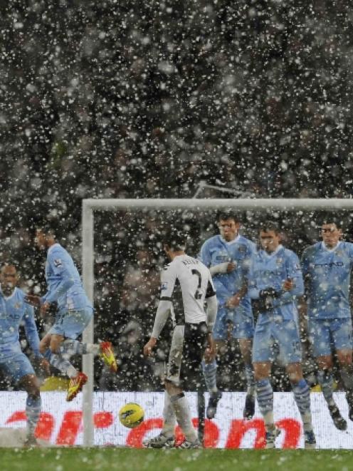 Fulham's Chris Baird takes a free kick against Manchester City at the Etihad stadium in...
