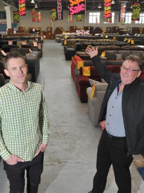 Furniture Warehouse directors Matt (left) and John Williamson in the Stafford St premises. Photo...
