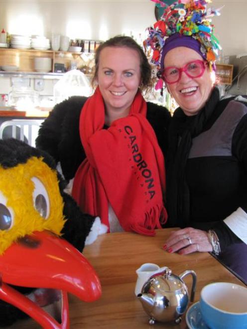 Gemma Wilson, wearing half of Cardrona Alpine Resort mascot Pengi's suit, enjoys afternoon tea...