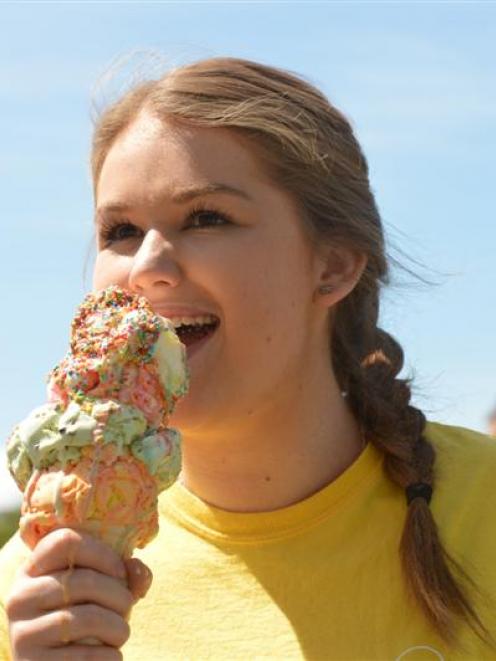 Georgia Baird, from the Rob Roy Dairy, in Dunedin, tackles an  ice cream  in the heat. Photo by...
