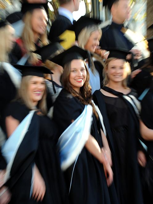 Georgie Austin-Ellas (23, centre) was one of the hundreds of University of Otago graduands to...