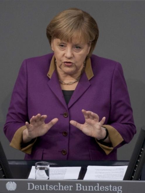 German Chancellor Angela Merkel speaks during a debate before a parliamentary vote on a Greek...