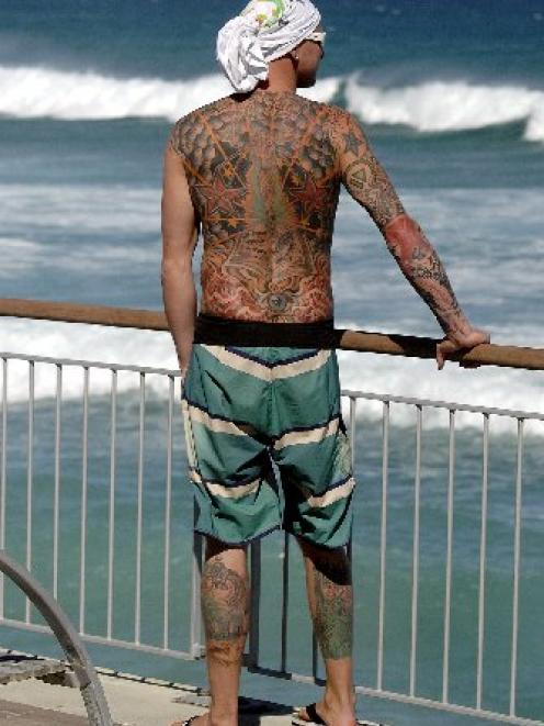German tourist Oliver Wild looks out over St Clair Beach, waiting for inspiration  to tell him...