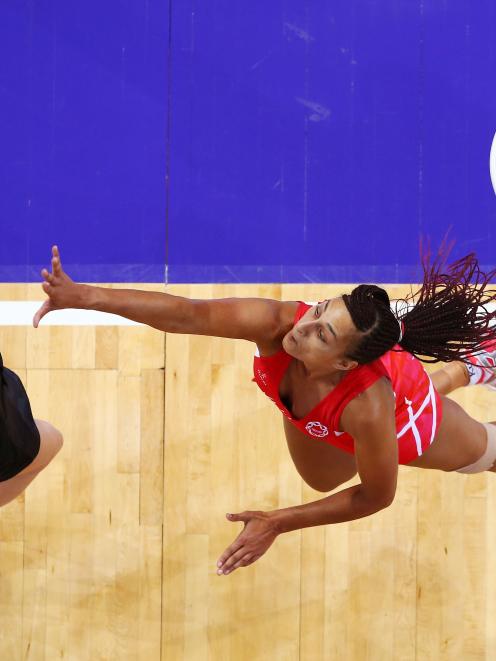 Geva Mentor of England defends against Bailey Mes of New Zealand during the 2015 Netball World...