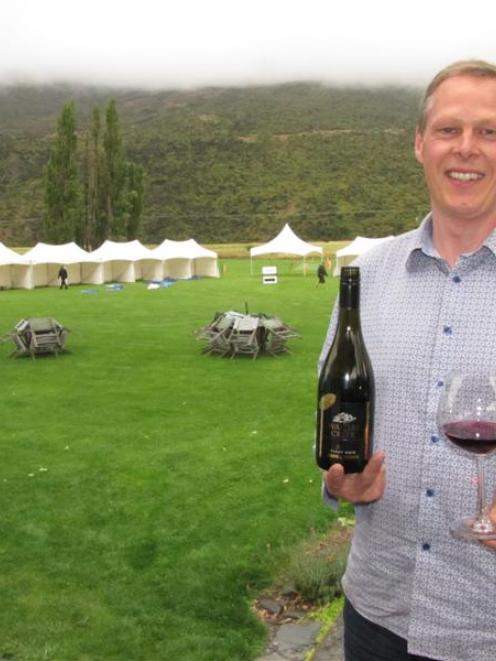 Gibbston Harvest Festival committee member and Waitiri Creek Winery manager Jason Moss samples a...