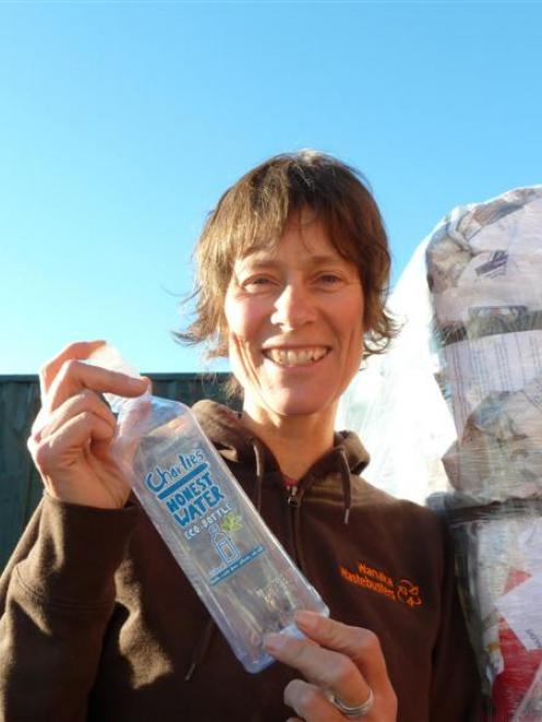 Gina Dempster  with a Charlie's bottle, which cannot be recycled in Wanaka.  Photo by Sophie Ward.
