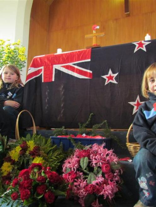 Girl Guides Lily Tepper (8, top left),  Ivy Tepper (6, left)  and Charlotte Elliott (5) with the...