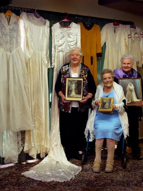 Gladys Morris (85), Nancy Edwards (97) and Noelene Wilson (82) pose with their wedding dresses...