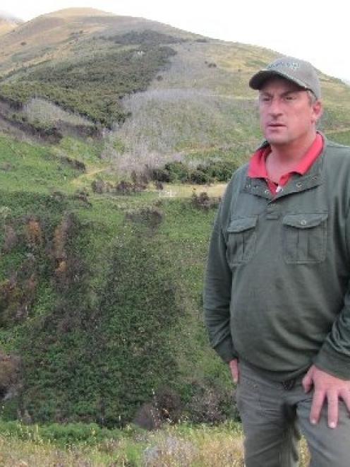Glen Dene Station owner Richard Burdon inspects the natural recovery process of land at Craig...