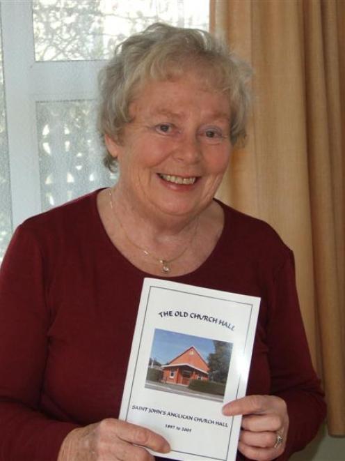 Glen Taylor, of Milton, at home with her book on the old St John's Anglican Church hall. Photo by...