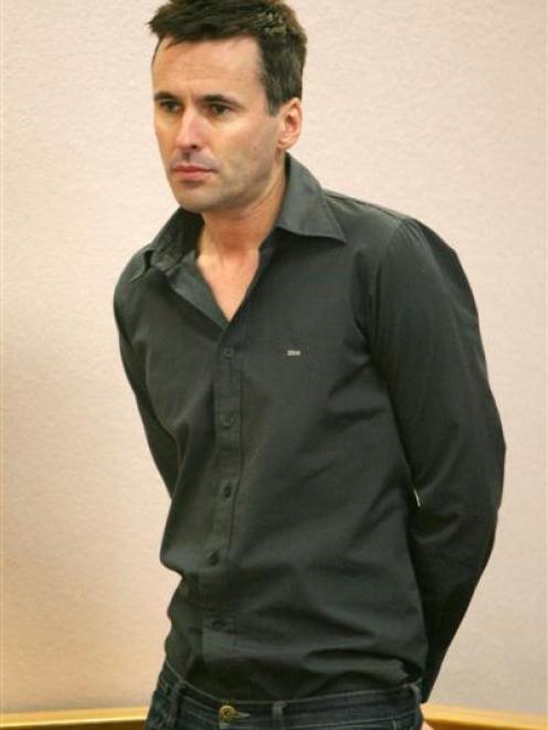 Glenn Richard Albert Mills stands in the dock at the Auckland District Court accused of...