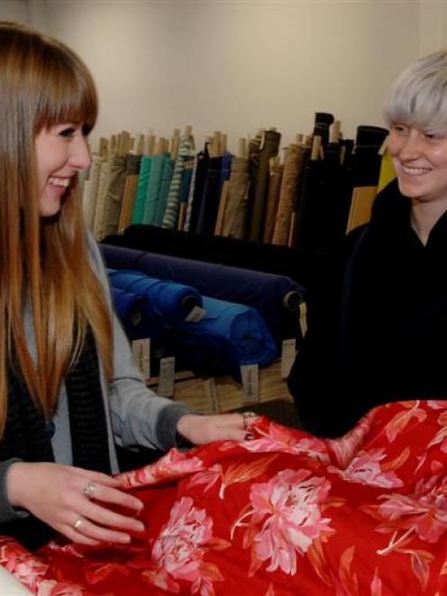 Global Fabrics staff  Mackenzie Taiaroa (left) and Grace Averis,  in the lower Stuart St outlet...