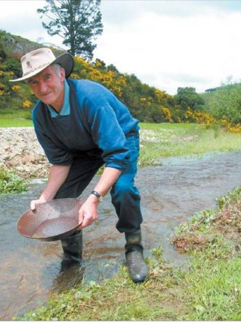 Gold fever: Lawrence man Ernie McCraw tries his hand at prospecting in Tuapeka Creek, near...