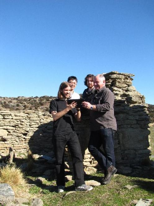 Goldfields historian Lloyd Carpenter (right) tests out a soon-to-be-released app with developers...
