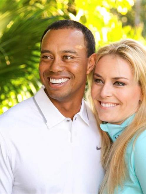 Golfer Tiger Woods and downhill skier Lindsey Vonn pose in this undated handout photo. REUTERS...
